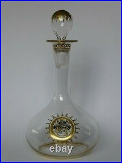 Antique gilded nineteenth century decanter with very fine enamel coat of arms